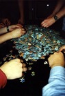 Random picture: People trying to solve the puzzle that Christer got as a present.